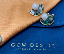 Round Freshwater Pearl set on semi-lunar Abalone Shell