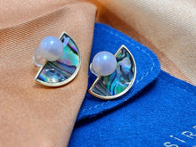 Round Freshwater Pearl set on semi-lunar Abalone Shell