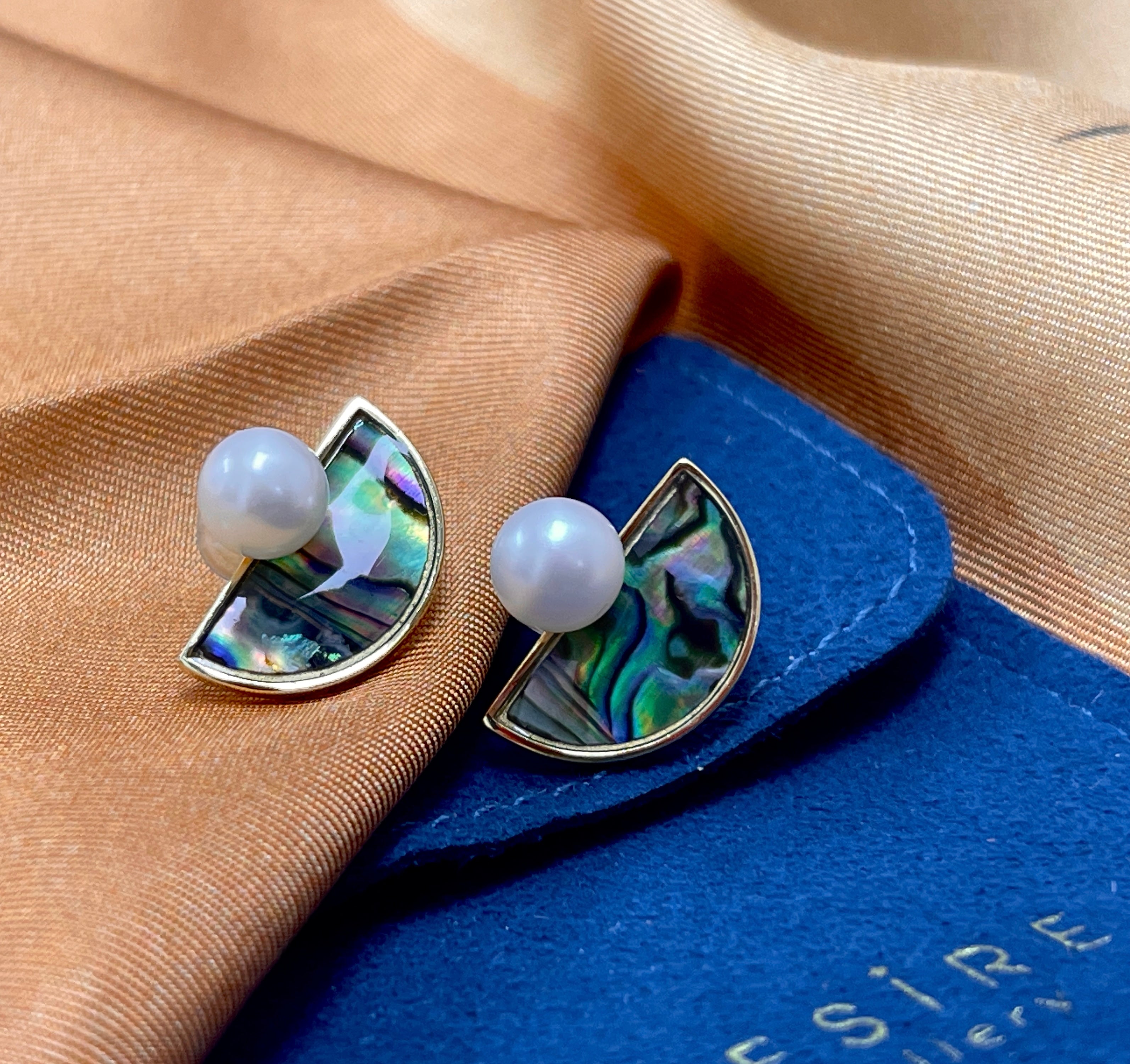 Round Freshwater Pearl set on semi-lunar Abalone Shell