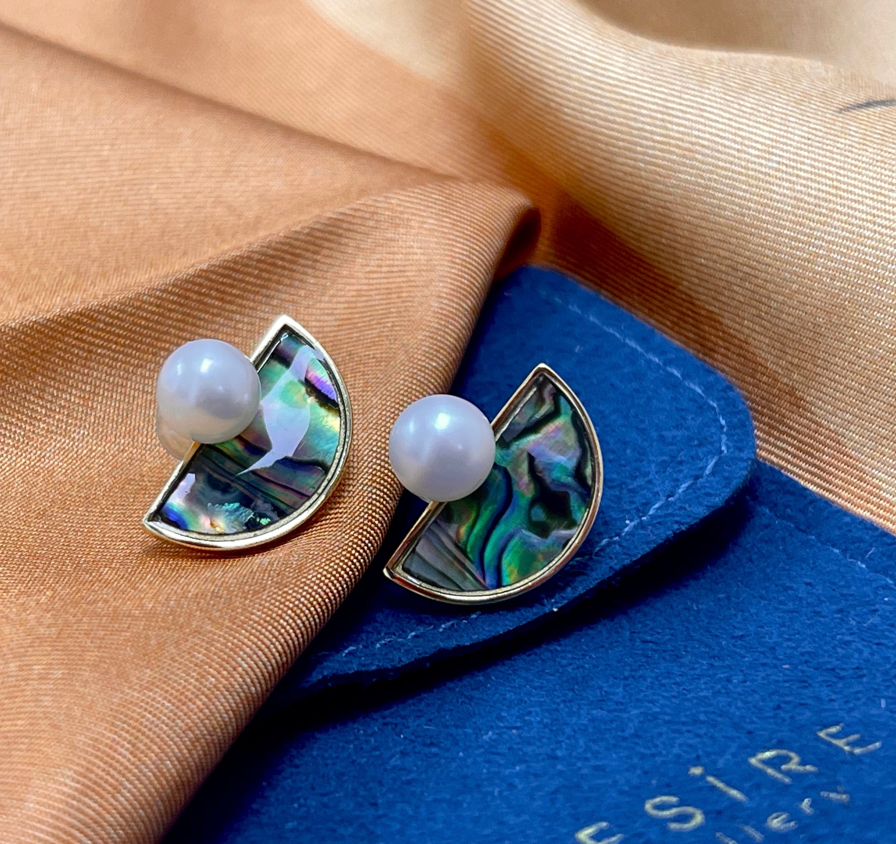 Round Freshwater Pearl set on semi-lunar Abalone Shell